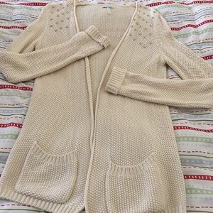 Cream color silver studded sweater.